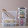 Probox is series of premium storage boxes. They are modular and made of translucent material. All boxes are equipped with QR codes compatible with the BoxPointer app. Containers are stacked on the ground and have household items inside.