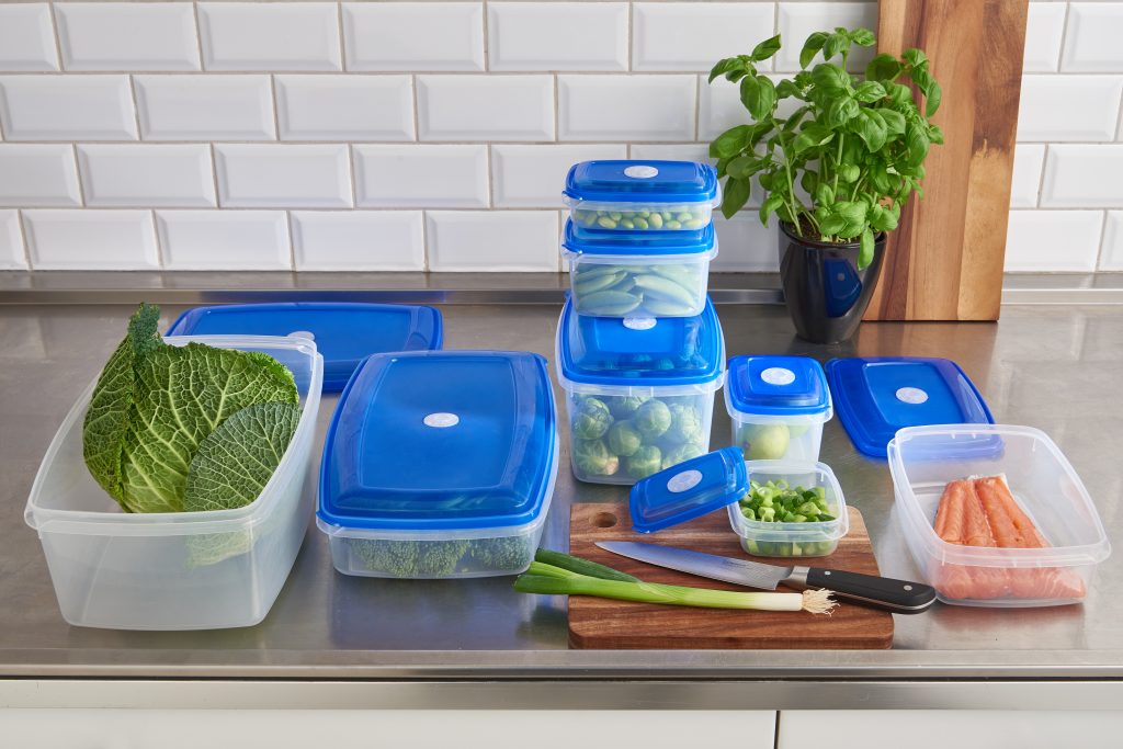 Top Box food storage boxes are avaliable in various sizes and shapes. Also, they are stackable to save space in a fridge. Series of containers stand on the tabletop.